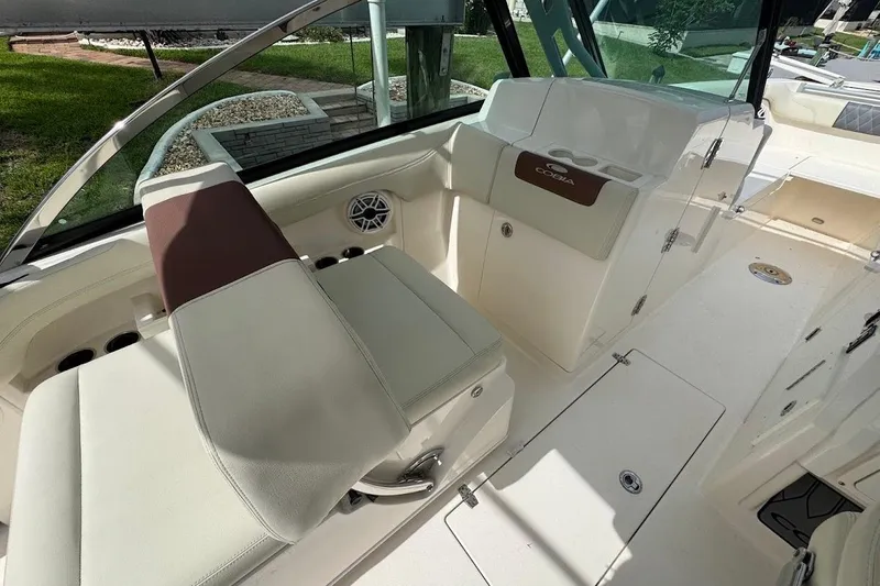 Slide: The Image of Interior of a 2020 Cobia 280 Dual Console boat with seating and storage. - 30