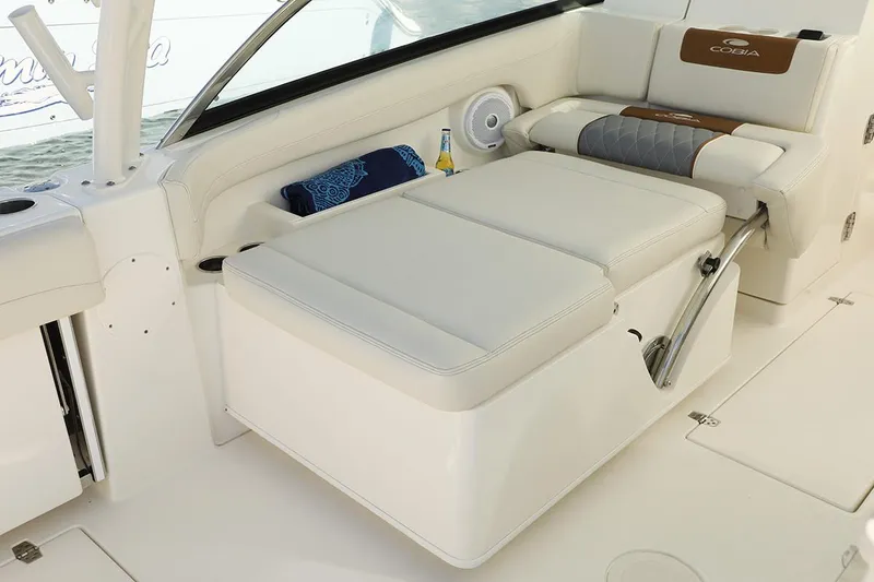 Slide: The Image of Manufacturer Provided Image: 2020 Cobia 280 Dual Console boat interior with white cushioned seating. - 19