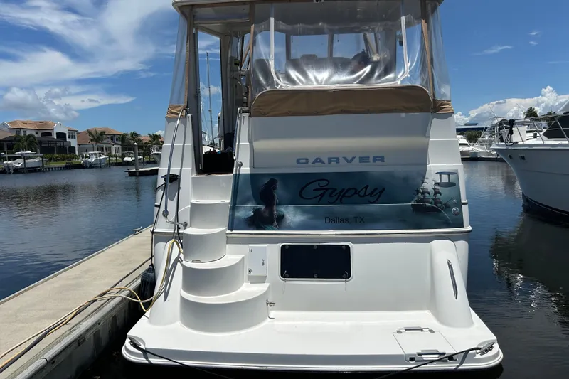 Slide: The Image of 2005 Carver 36 Motor Yacht docked, featuring "Gypsy" name and Dallas, TX location. - 7