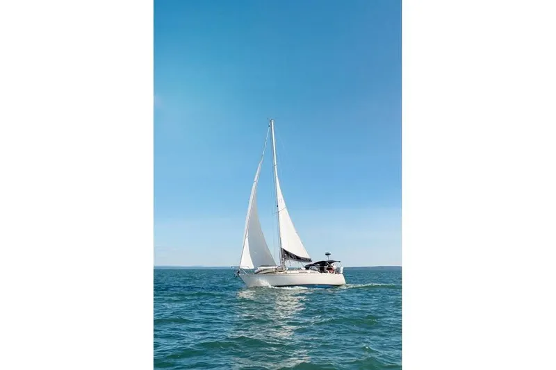 The Image of Sailing yacht Sabre 34 MK II (1989) gliding on open sea under clear blue sky. - 0