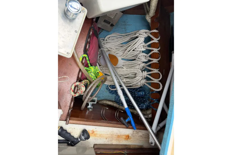 Slide: The Image of Interior of 1989 Sabre 34 MK II sailboat with ropes and equipment. - 14