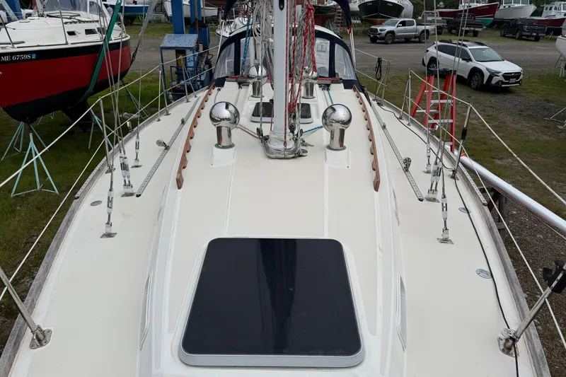 Slide: The Image of 1989 Sabre 34 MK II sailboat deck view in a boatyard setting. - 17