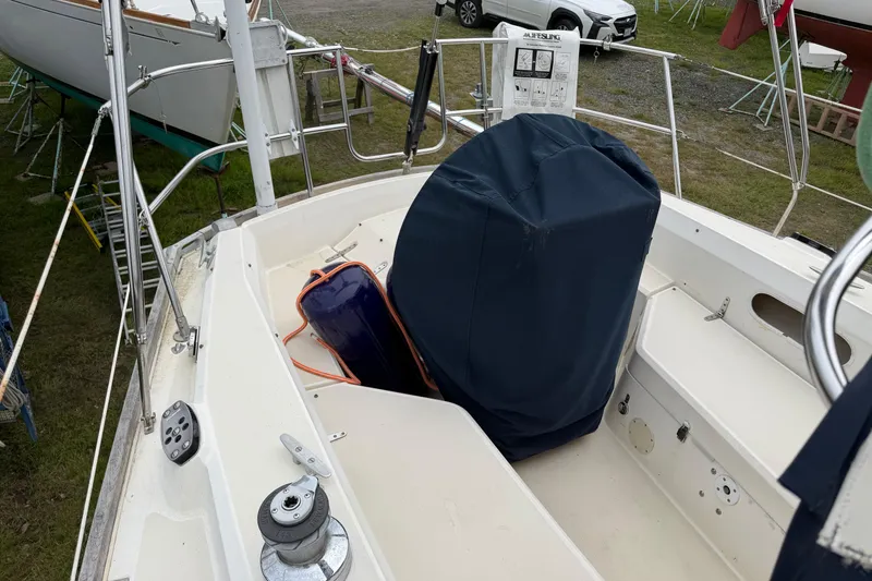 Slide: The Image of Cockpit of 1989 Sabre 34 MK II sailboat with covered equipment and winch. - 18