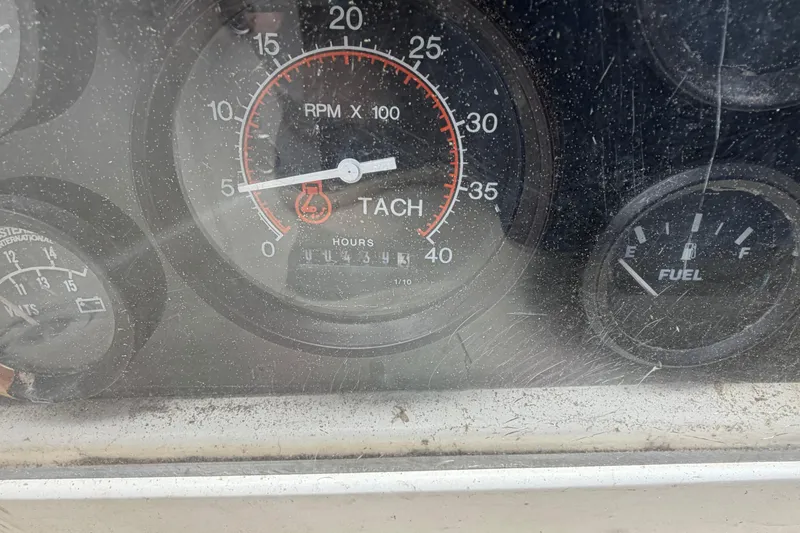 Slide: The Image of Close-up of a Sabre 34 MK II 1989 tachometer and fuel gauge, showing RPM and fuel levels. - 23