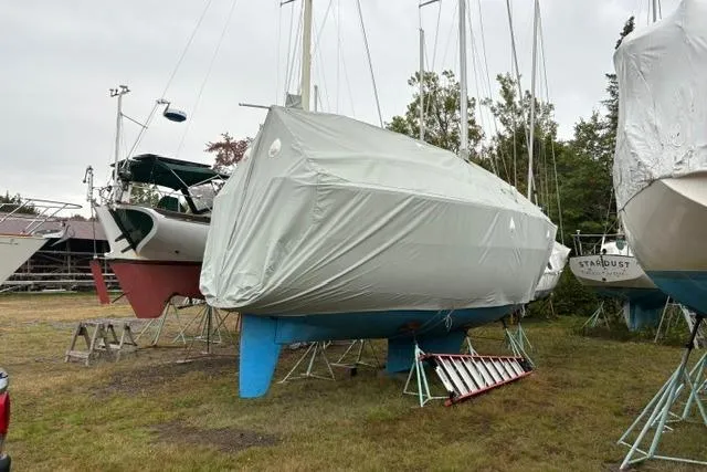 Slide: The Image of Covered 1989 Sabre 34 MK II sailboat on stands in a boatyard. - 29