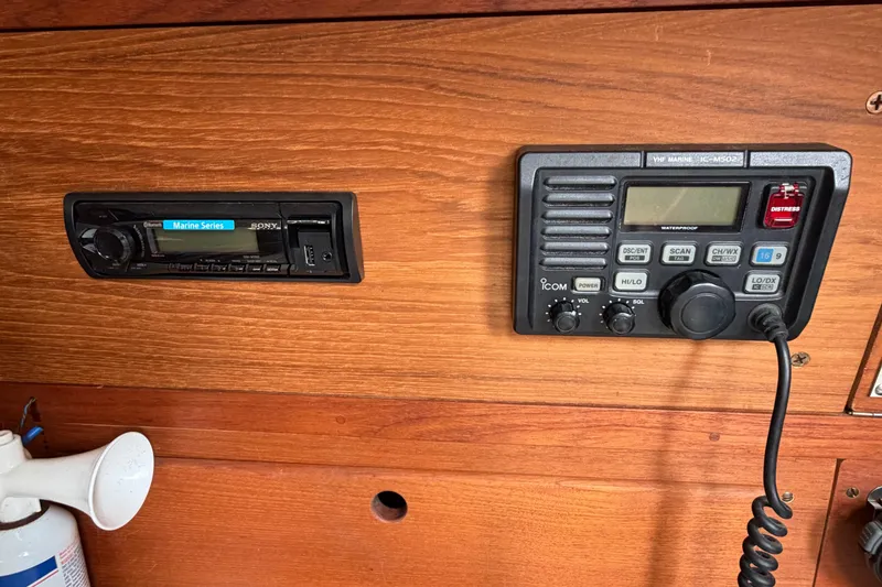 Slide: The Image of Wooden interior of 1989 Sabre 34 MK II with marine radio and stereo system. - 4