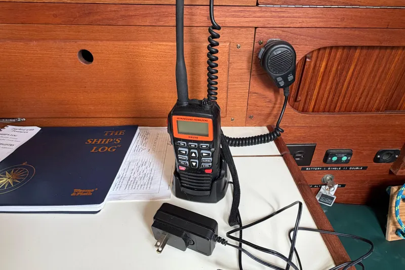 Slide: The Image of VHF radio and ship's logbook on Sabre 34 MK II, 1989 yacht interior. - 5