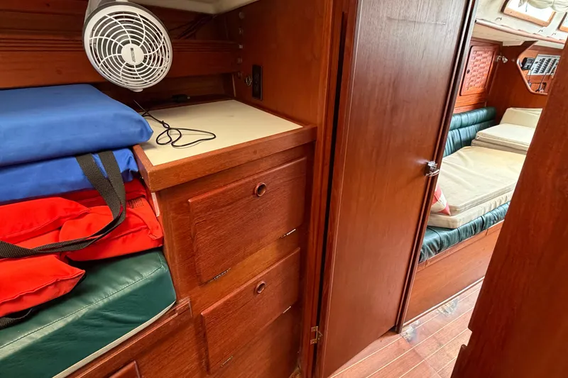 Slide: The Image of Interior of 1989 Sabre 34 MK II sailboat with wooden cabinetry and seating area. - 9
