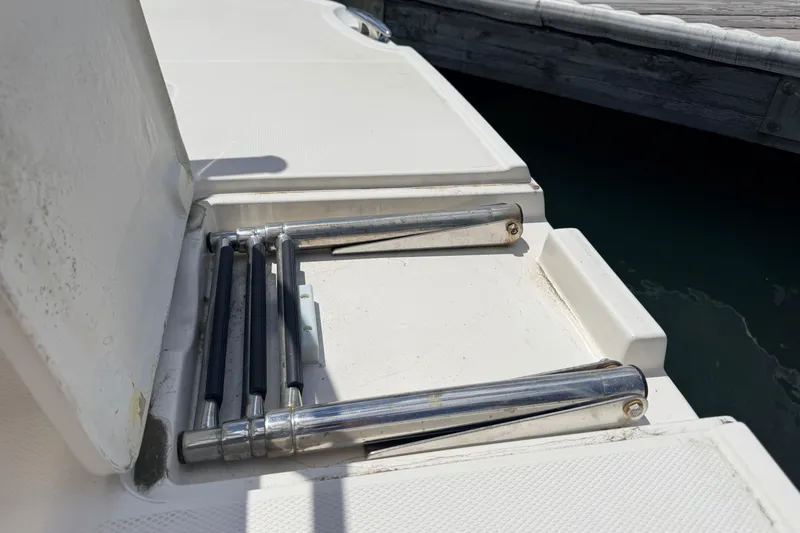 Slide: The Image of Foldable ladder on a 2011 Monterey 320 Sport Yacht, dockside view. - 28