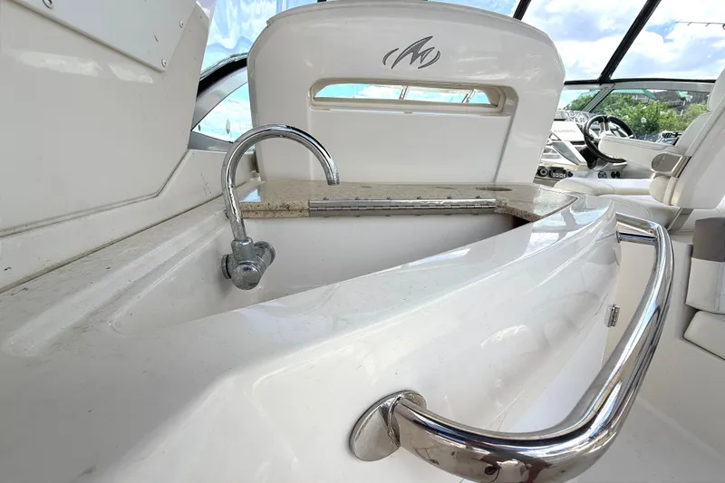 Slide: The Image of 2011 Monterey 320 Sport Yacht interior with sink and chrome fixtures. - 8