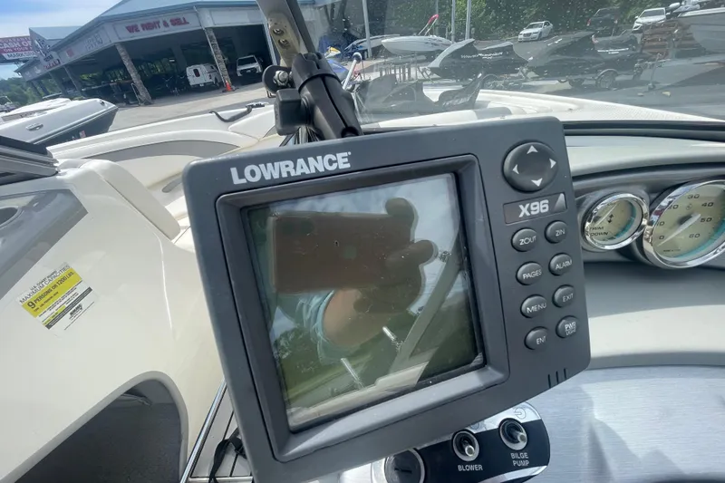 Slide: The Image of 2008 Bayliner 195 Bowrider dashboard with Lowrance X96 fishfinder and gauges. - 11