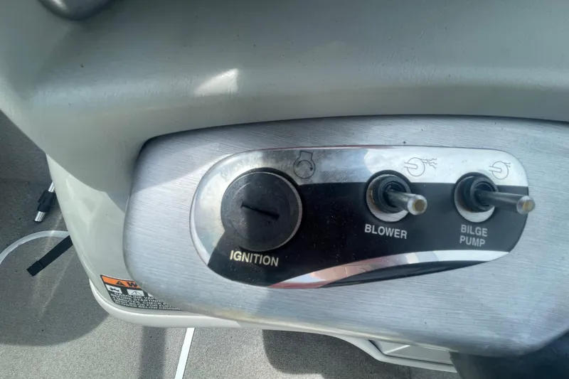 Slide: The Image of Control panel of a 2008 Bayliner 195 Bowrider with ignition, blower, and bilge pump switches. - 12