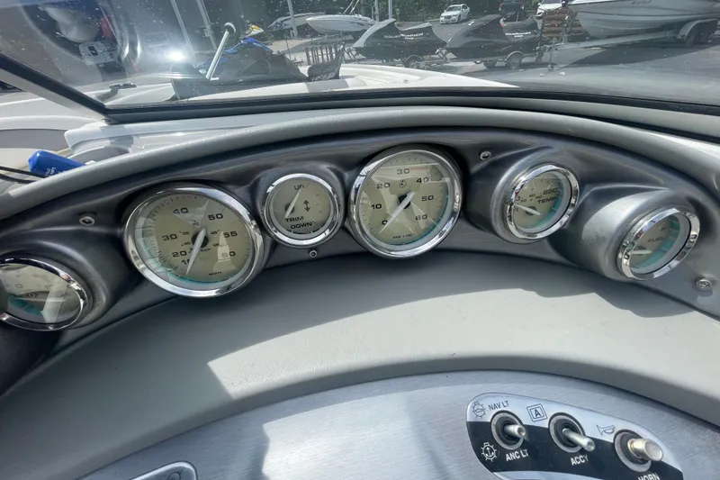Slide: The Image of Dashboard of a 2008 Bayliner 195 Bowrider boat with gauges and controls. - 14