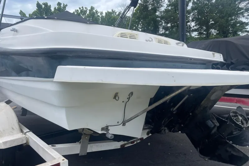 Slide: The Image of 2008 Bayliner 195 Bowrider boat on trailer, rear view with outboard motor. - 16