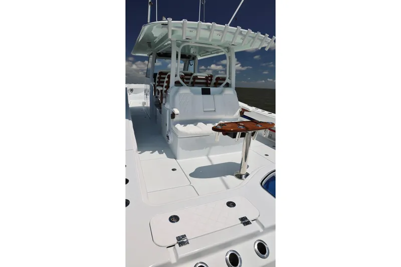 Slide: The Image of Freeman 43 boat interior, 2026 model, featuring sleek white design and modern seating. - 13