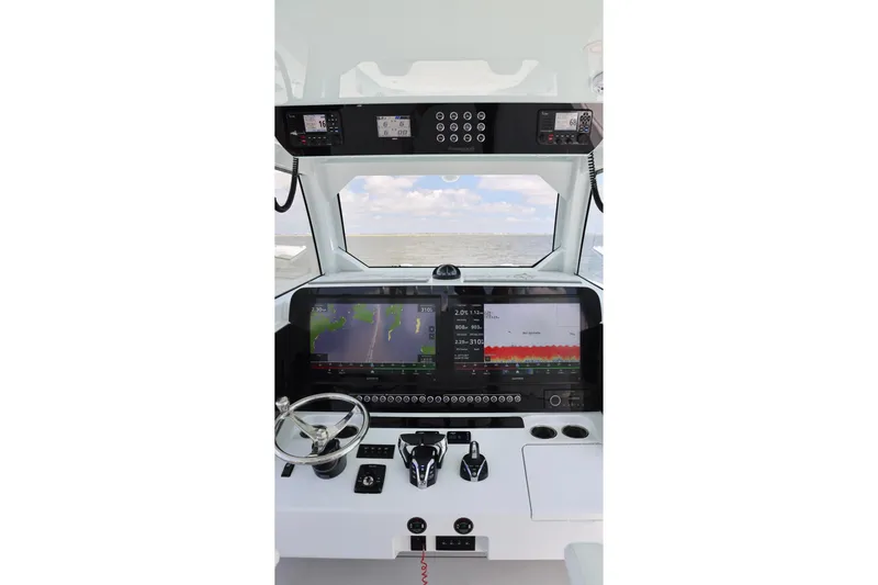 Slide: The Image of Interior view of 2026 Freeman 43 boat cockpit with advanced navigation system. - 18