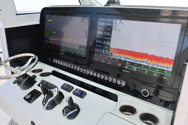 Slide: The Image of Helm of 2026 Freeman 43 boat with advanced Garmin navigation displays. - 19