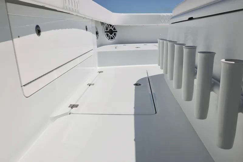 Slide: The Image of 2026 Freeman 43 boat deck with rod holders and storage compartments. - 22