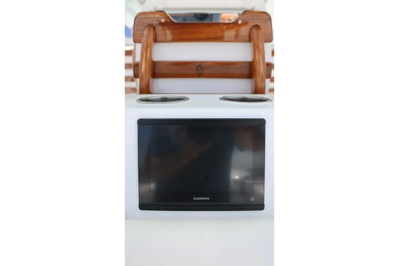 Slide: The Image of Garmin display on 2026 Freeman 43 boat console with wooden accents. - 25