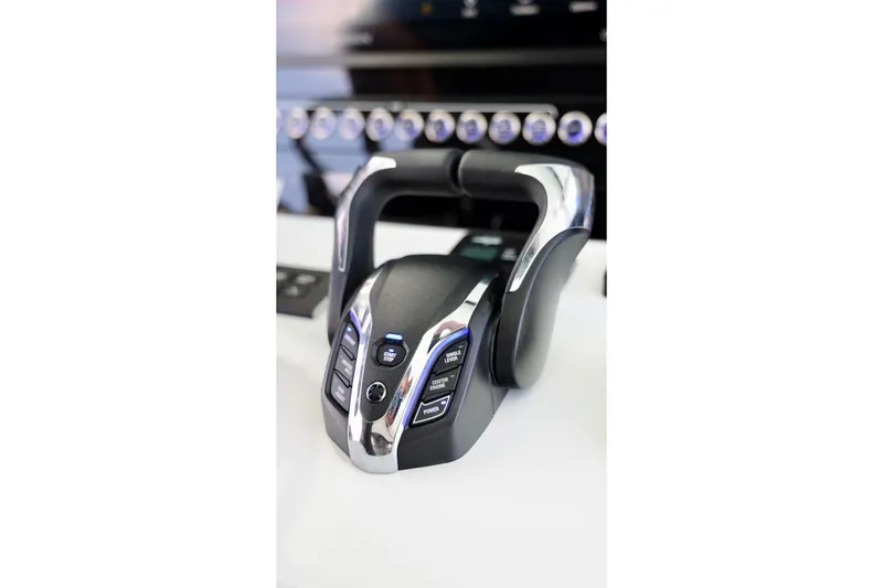 Slide: The Image of Throttle control system on a 2026 Freeman 43 boat dashboard. - 27