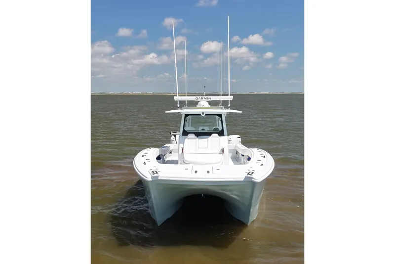 Slide: The Image of 2026 Freeman 43 boat on water under blue sky with clouds. - 4