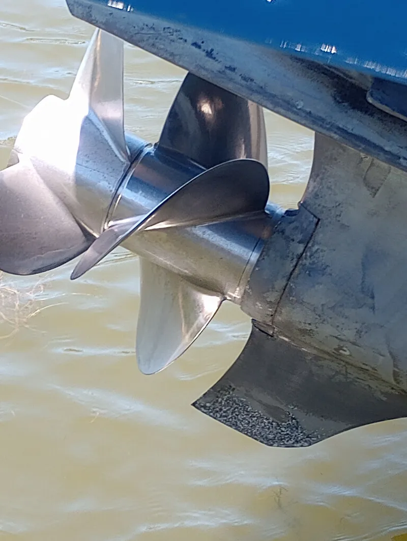 Slide: The Image of Close-up of a boat propeller in the water. - 48