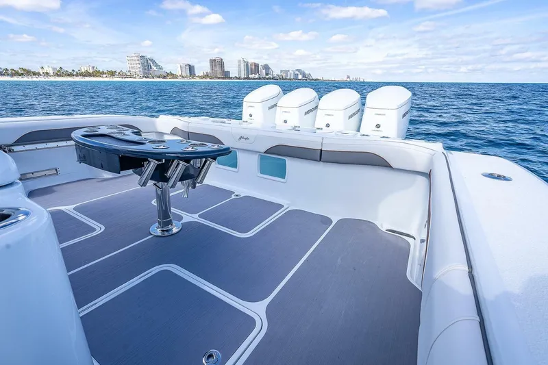 Slide: The Image of 2024 Yellowfin 54 Offshore boat deck with ocean view and city skyline. - 15