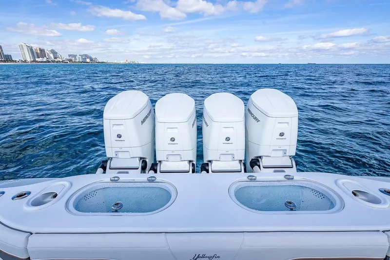Slide: The Image of 2024 Yellowfin 54 Offshore boat with four Mercury engines on open sea. - 16