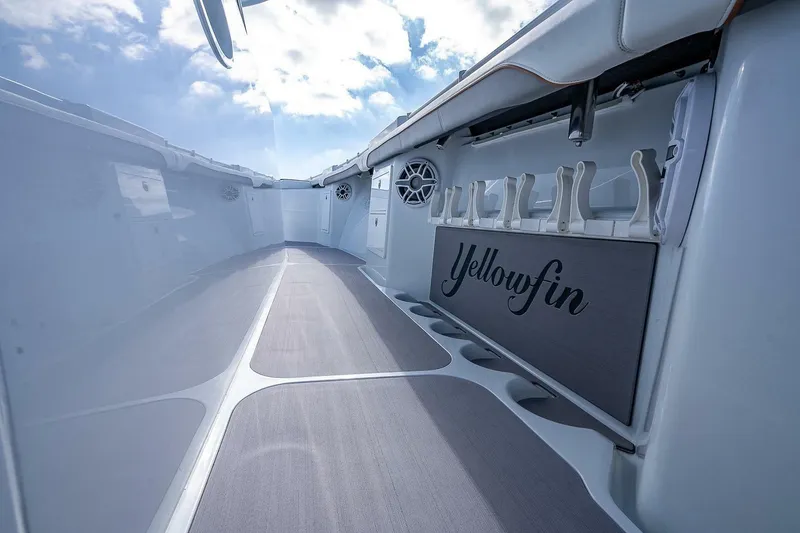 Slide: The Image of 2024 Yellowfin 54 Offshore boat interior with rod holders and sleek design. - 25