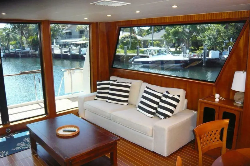 Slide: The Image of Luxurious interior of a 1990 Viking Cockpit Motor Yacht with waterfront view. - 7
