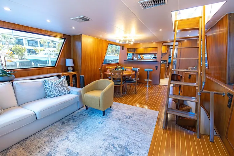 Slide: The Image of Luxurious interior of a 1990 Viking Cockpit Motor Yacht with elegant wood finishes and modern furnishings. - 13