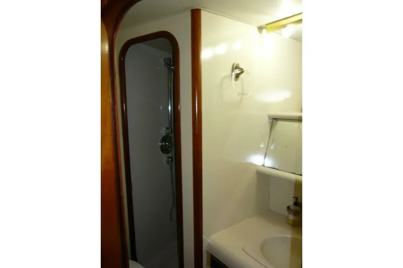 Slide: The Image of Bathroom interior of 1990 Viking Cockpit Motor Yacht with shower and sink. - 41