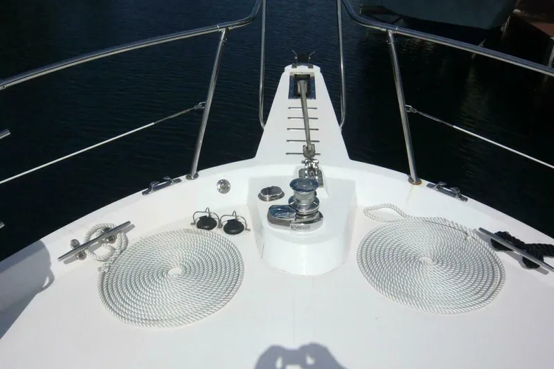 Slide: The Image of Bow of a 1990 Viking Cockpit Motor Yacht with anchor and coiled ropes. - 68
