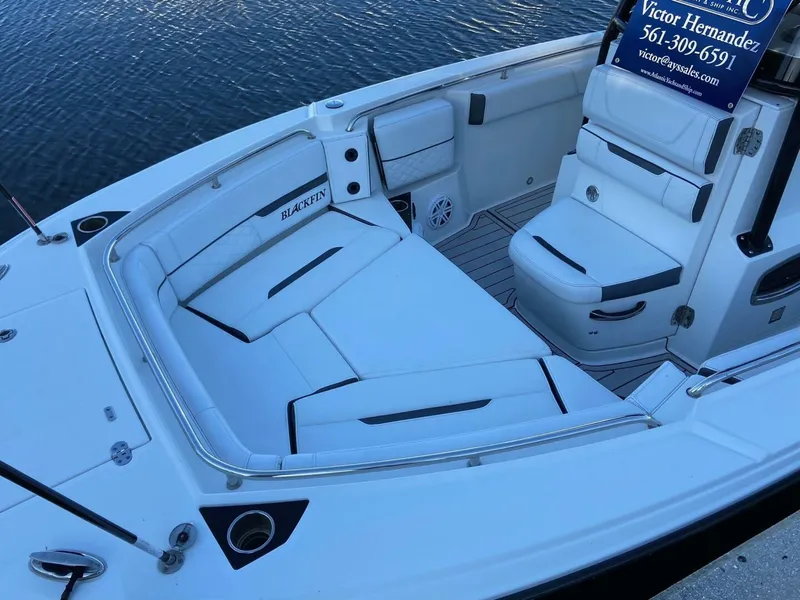 Slide: The Image of 2021 Blackfin 252 boat interior with white seating and storage compartments. - 6