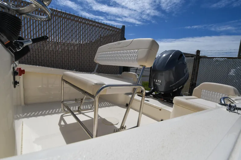 Slide: The Image of 2026 Scout 188 Sportfish boat interior with seating and Yamaha 115 engine. - 11
