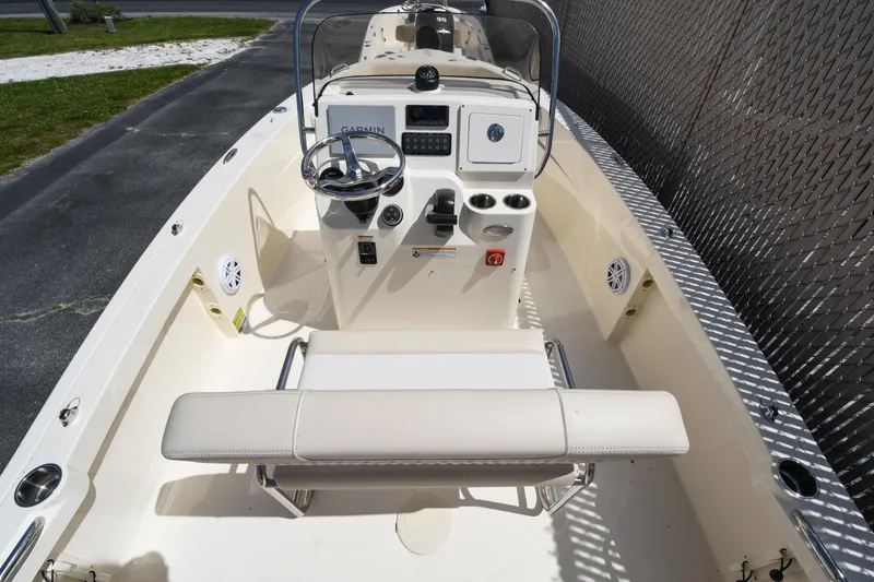Slide: The Image of 2026 Scout 188 Sportfish boat interior with steering console and seating. - 12