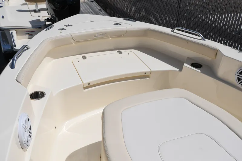 Slide: The Image of 2026 Scout 188 Sportfish boat interior with seating and storage compartments. - 3