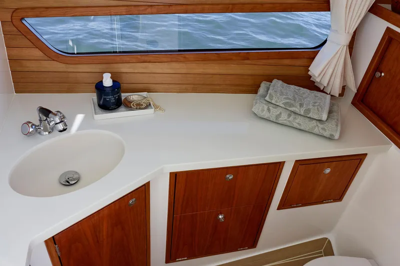 Slide: The Image of Luxurious bathroom interior of 2026 MJM 38x yacht with wooden cabinetry and ocean view. - 13