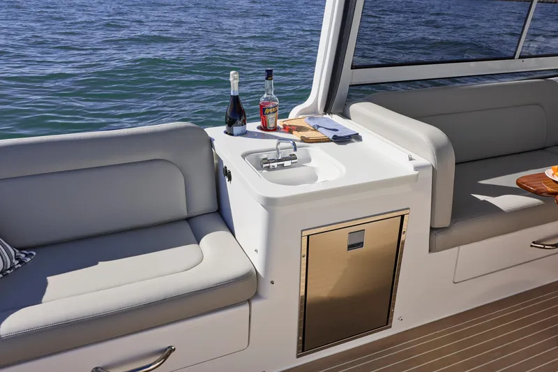 Slide: The Image of Luxury seating area on 2026 MJM 38x boat with drinks and sink. - 19