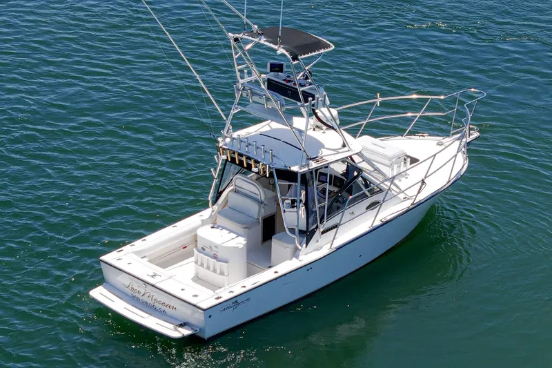 Slide: The Image of 1999 Albemarle 290 Express Fisherman boat on calm blue water. - 10