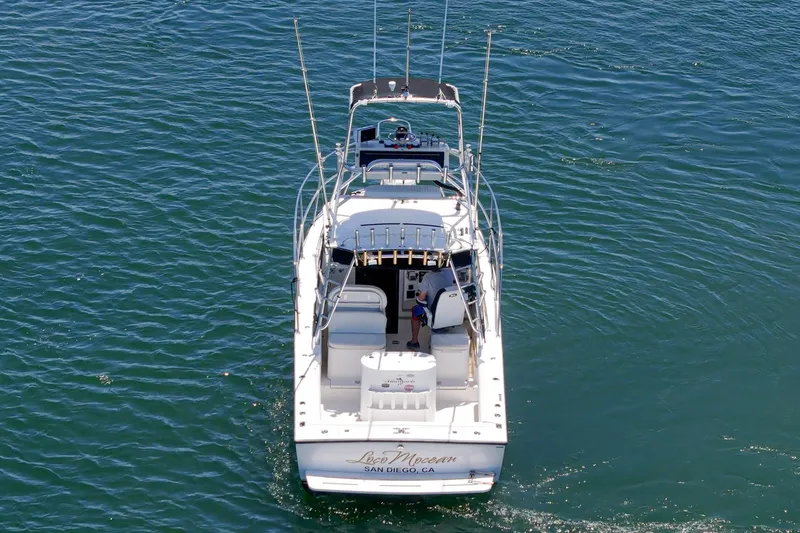 Slide: The Image of 1999 Albemarle 290 Express Fisherman boat cruising on open water. - 11