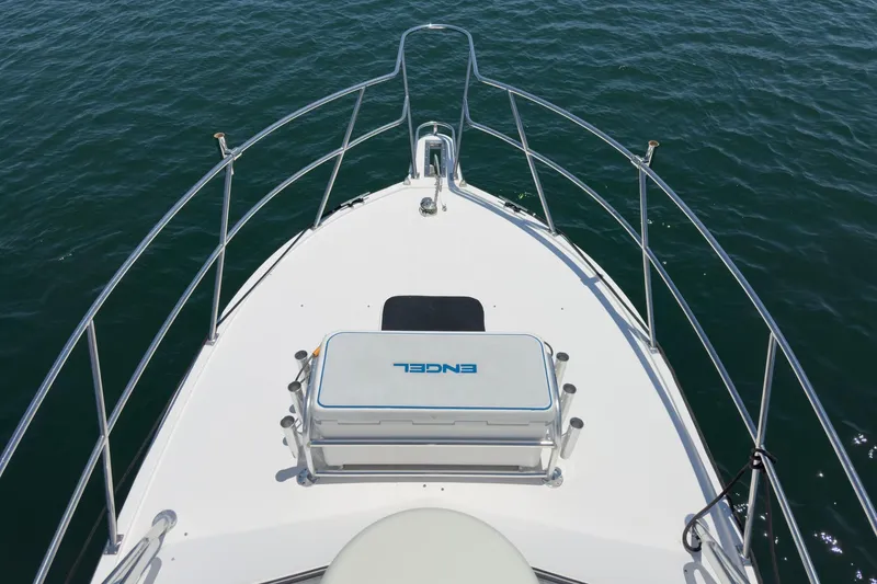 Slide: The Image of 1999 Albemarle 290 Express Fisherman boat deck on calm water. - 21