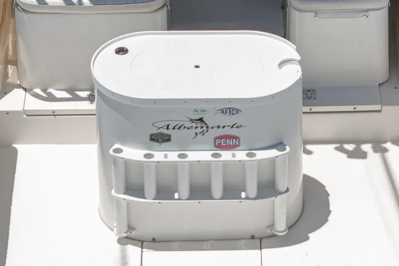 Slide: The Image of 1999 Albemarle 290 Express Fisherman boat deck with fishing rod holders and branded logos. - 23