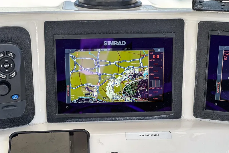Slide: The Image of Simrad navigation display on 1999 Albemarle 290 Express Fisherman boat dashboard. - 38