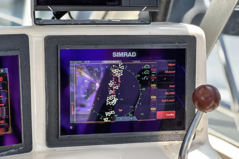 Slide: The Image of Simrad navigation display on 1999 Albemarle 290 Express Fisherman boat dashboard. - 39