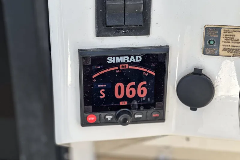 Slide: The Image of Simrad navigation display on 1999 Albemarle 290 Express Fisherman boat dashboard. - 41