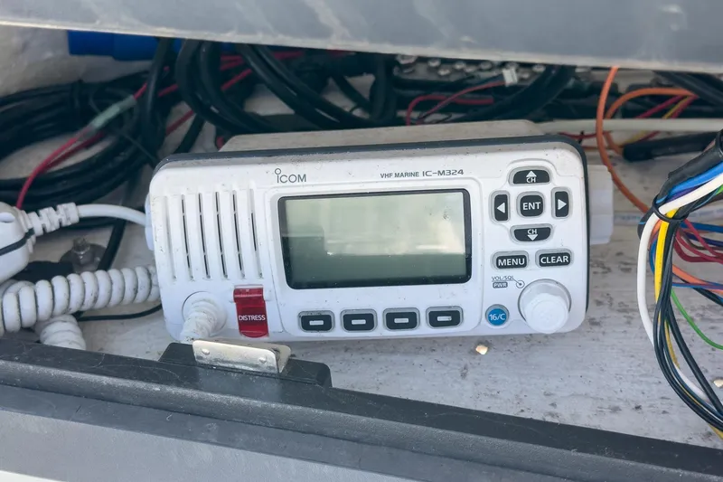 Slide: The Image of VHF marine radio on 1999 Albemarle 290 Express Fisherman boat, surrounded by wiring. - 43