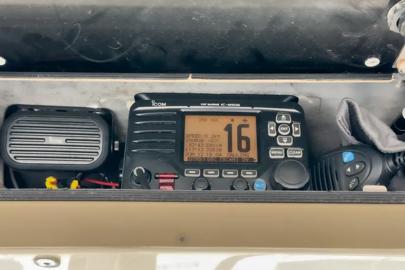 Slide: The Image of ICOM marine radio equipment on a 1999 Albemarle 290 Express Fisherman boat. - 44