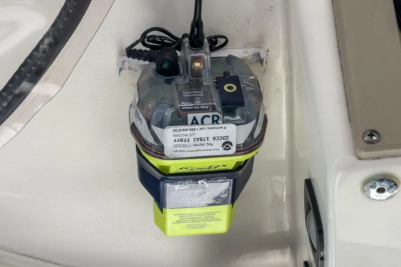 Slide: The Image of Emergency beacon device on a 1999 Albemarle 290 Express Fisherman boat. - 45