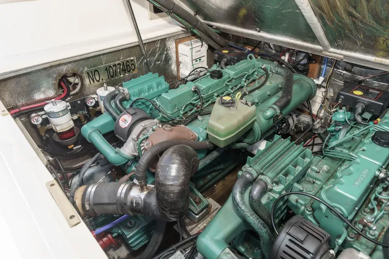 Slide: The Image of Engine compartment of a 1999 Albemarle 290 Express Fisherman boat, showcasing dual engines. - 60
